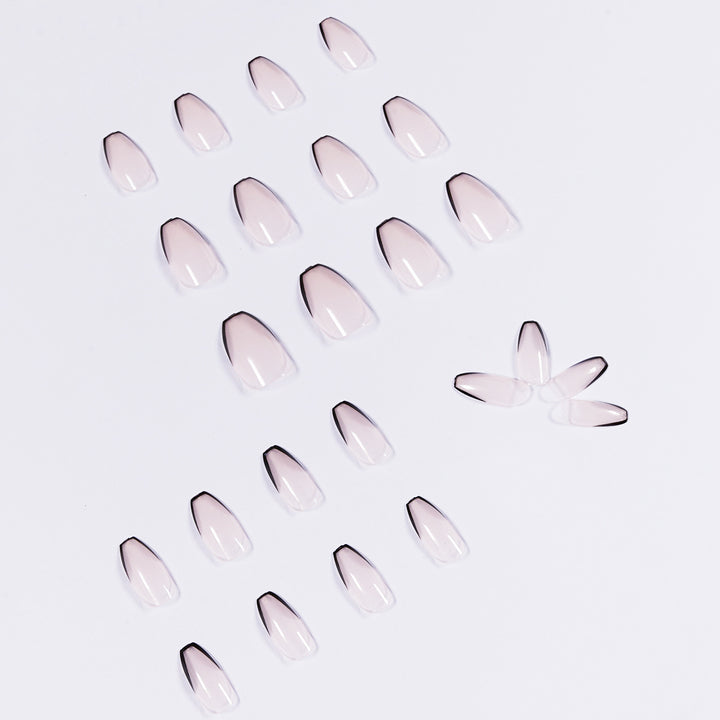 Artful stiletto nails with elegant black tip decoration Stornfield