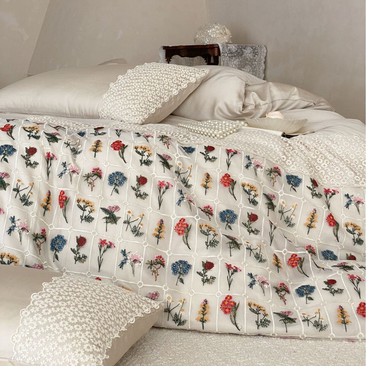 Embroidered duvet and bedspread with floral patchwork embroidery