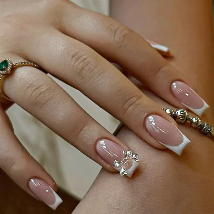 Artificial nail set with glamorous French tips and sparkling accents Stornfield