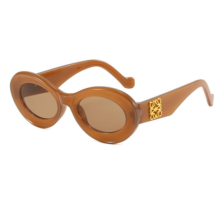 Women's fashionable sunglasses with oval frame and golden applications Stornfield