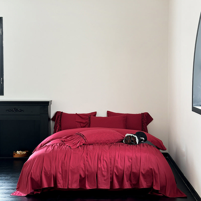 Elegant satin bedding set with pleated detail, jacquard design & ruffle