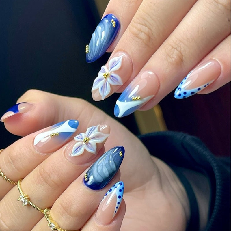 Nail set with handmade floral designs and elegant glitter Stornfield
