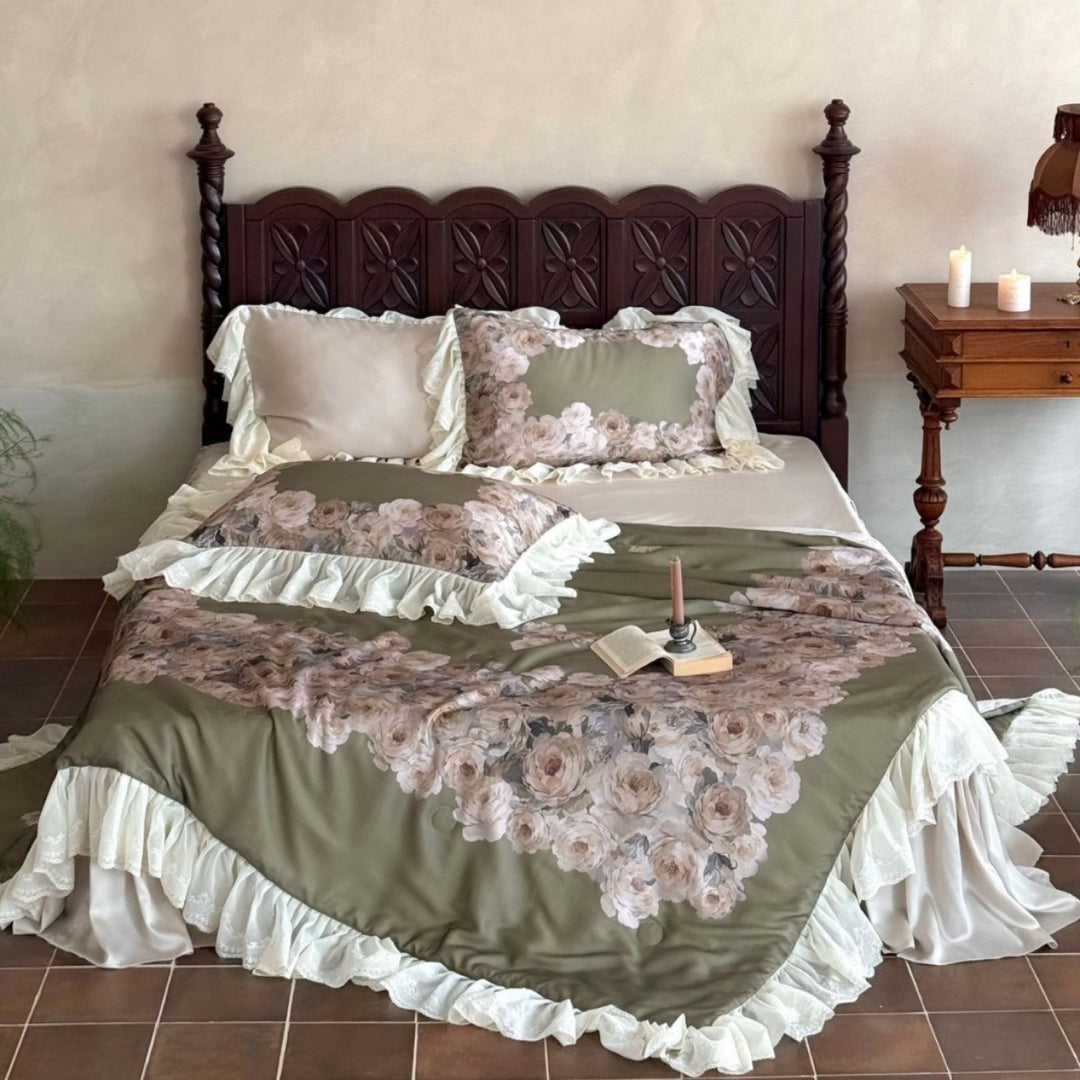 Vintage-inspired satin bedding with elaborate ruffled flounces and rose embroidery