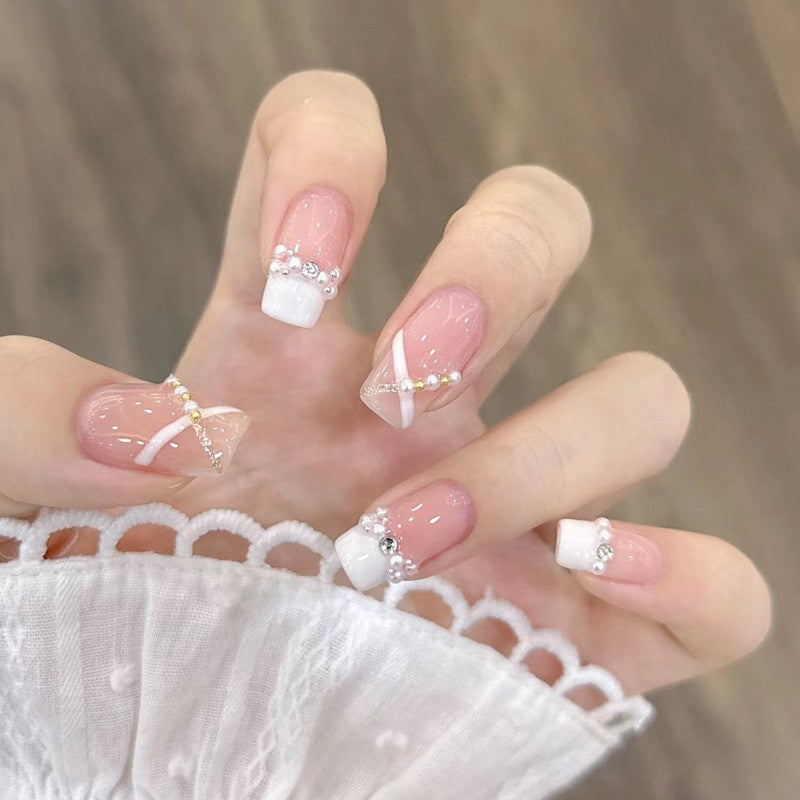 Artificial nails with heart design and glamorous accents Stornfield