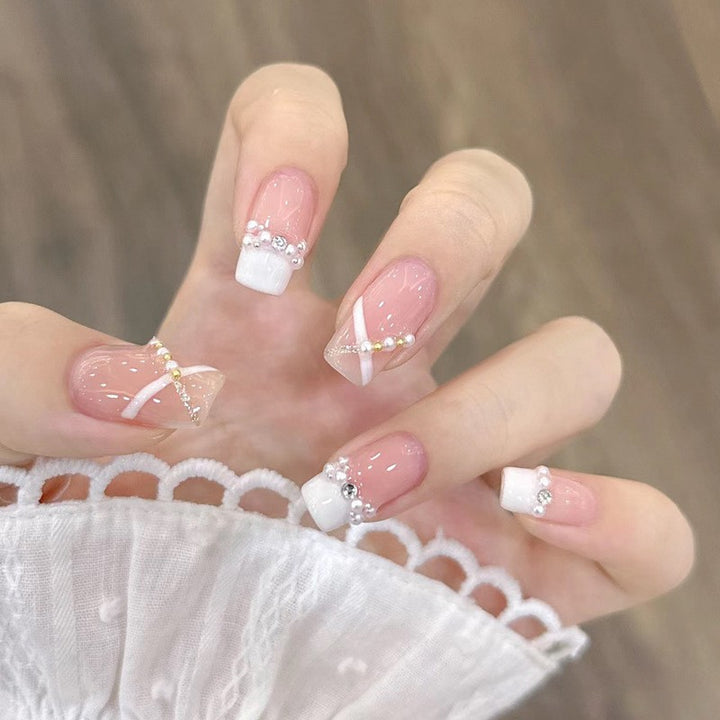 Artificial nails with heart design and glamorous accents Stornfield