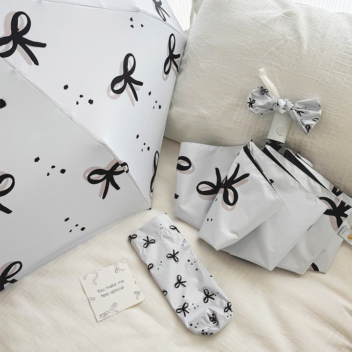 Women’s Folding Umbrella with Playful Bow Pattern Stornfield
