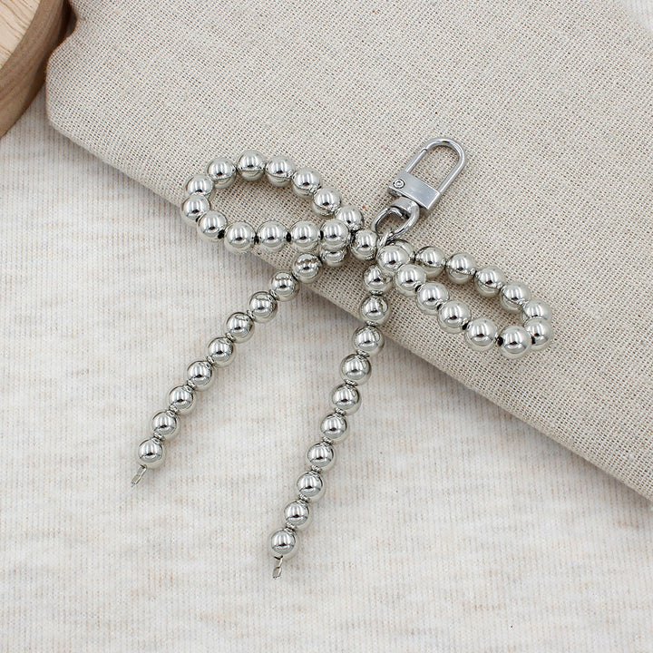 Elegant Pearl Bow Keychain Stornfield