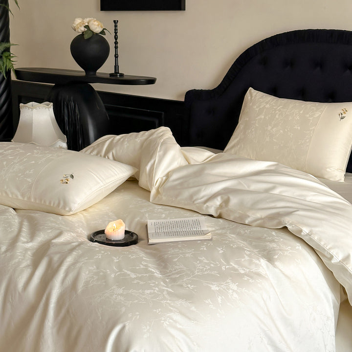 High-gloss satin bedding set with subtle floral jacquard and breathable comfort lining