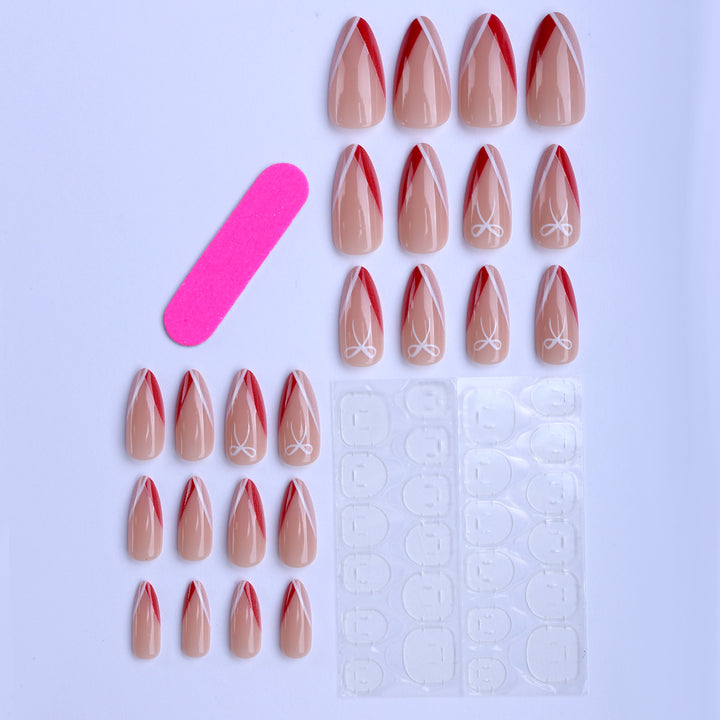 Artificial nails in elegant stiletto design with bow accents Stornfield