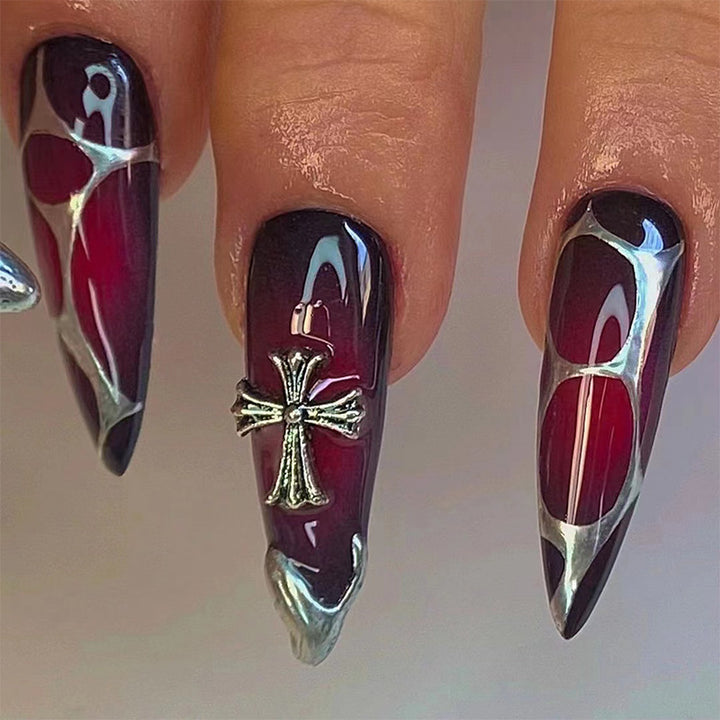 Artful Stiletto Nails with Elegant Cross Decoration Stornfield