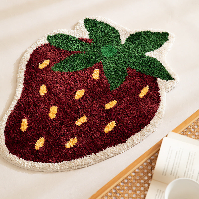 Playful hand-tufted strawberry mat made of dense cotton blend