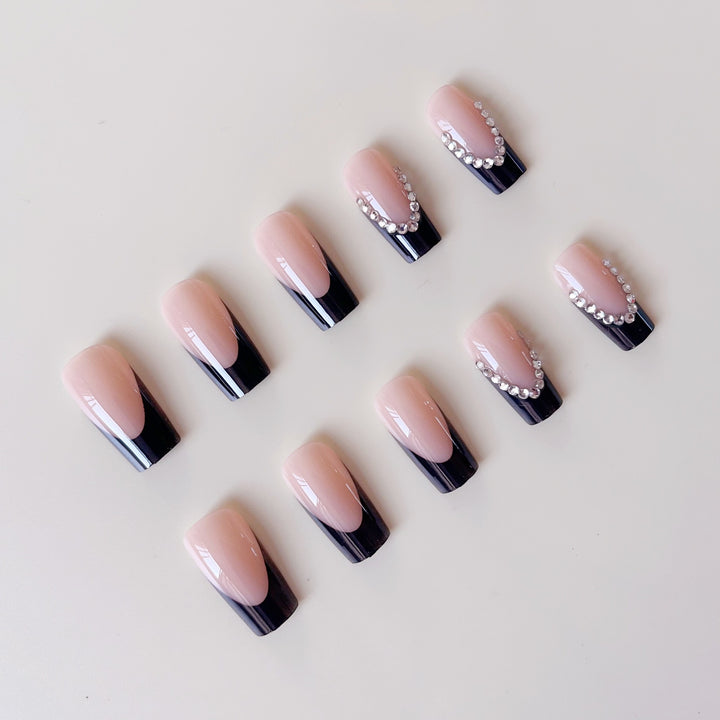 Artificial nail set with elegant tips and glitter accents Stornfield