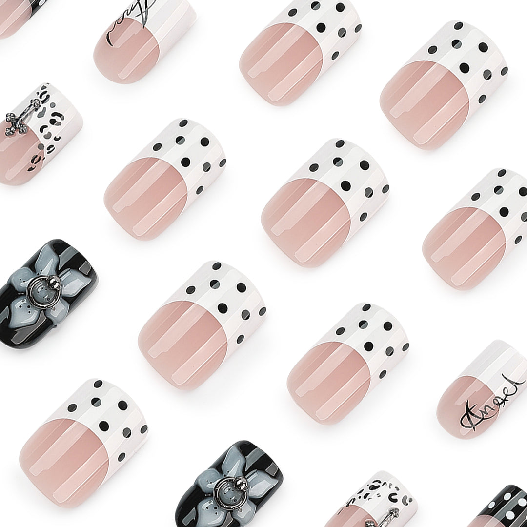 Artful nail extensions with elegant black-and-white design Stornfield