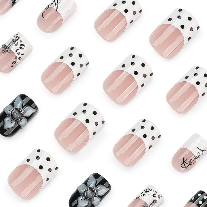 Artful nail extensions with elegant black-and-white design Stornfield