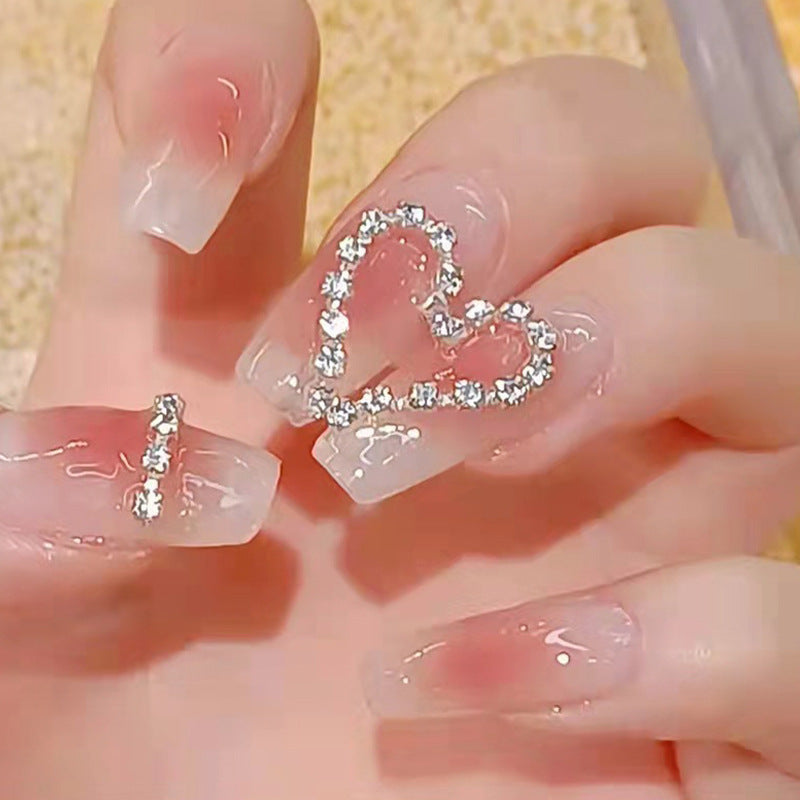 Artificial nails with romantic heart decorations Stornfield