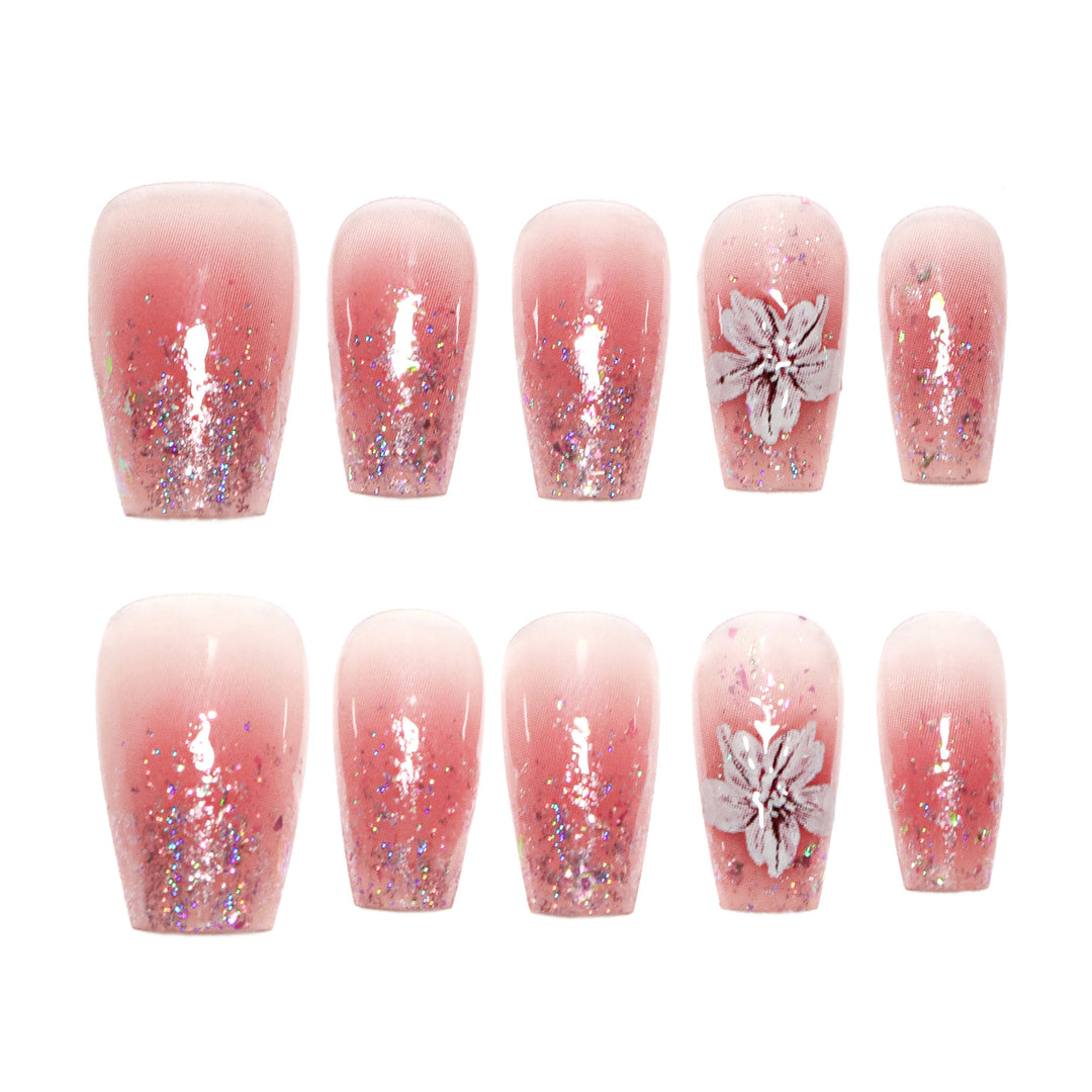 Artificial nail extensions with floral design and glitter accents Stornfield