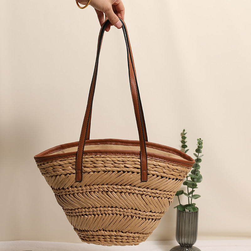 Braided basket bag with innovative leather handles Stornfield