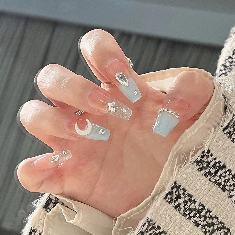 Glamorous artificial nails with delicate flower and glitter effects Stornfield