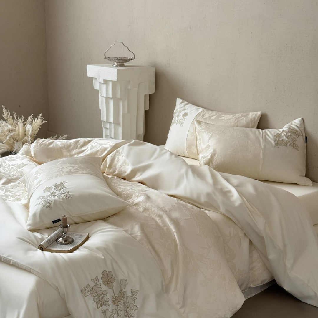 Silky satin bedding set with jacquard relief, floral embroidery, and ruffle