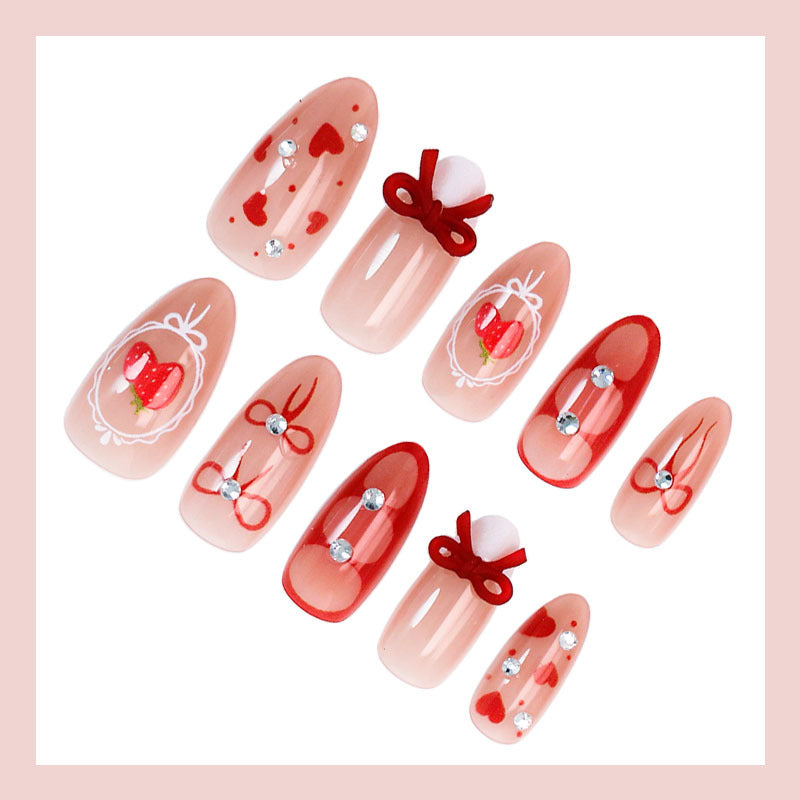 Artificial nail set with cute heart and bow designs Stornfield