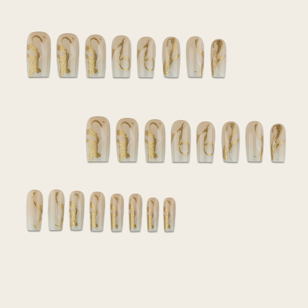 Artificial nails with elegant gold accents Stornfield