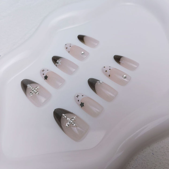 Glittering artificial nail design with elegant accents Stornfield