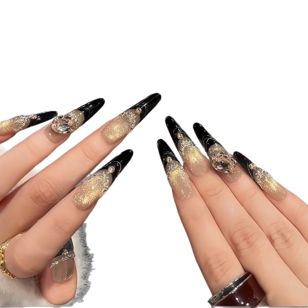 Glamorous artificial nails with extravagant rhinestone and glitter insets Stornfield