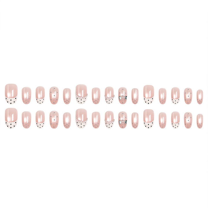 Artificial nail set with elegant French design and delicate pearl embellishments Stornfield
