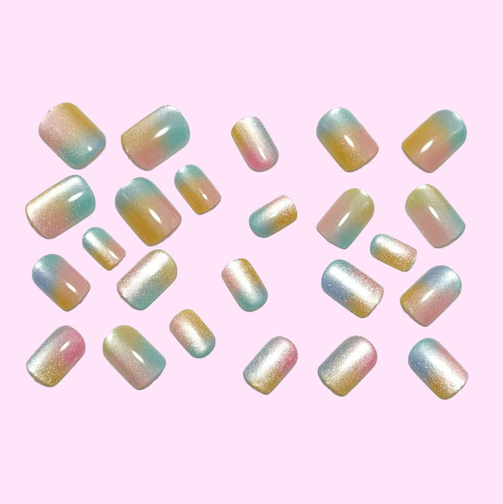 Artificial nails in delicate ombre design with glitter effects Stornfield
