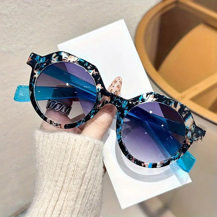 Ladies extravagant round sunglasses with colored accented frame Stornfield