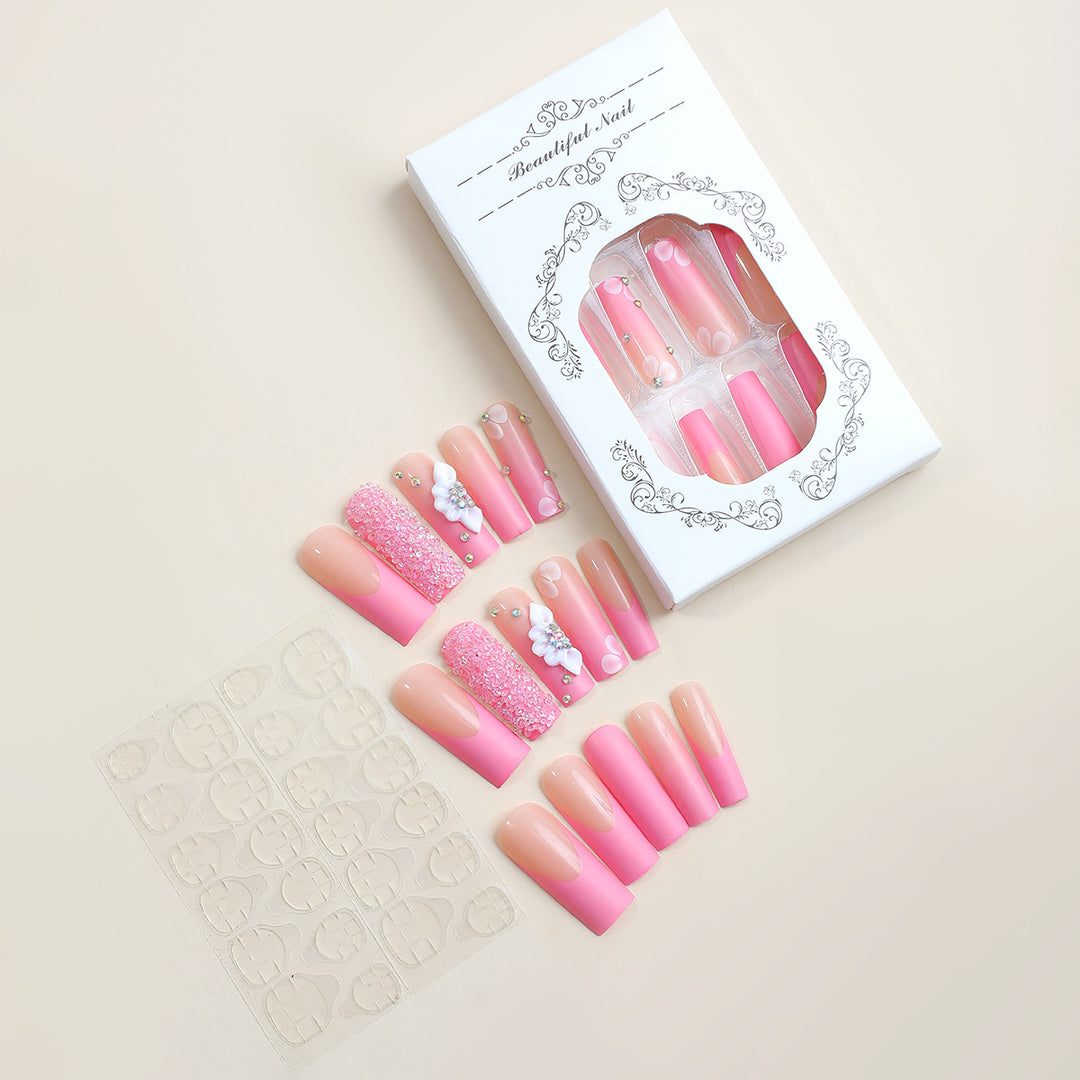 Acrylic nail set with sparkling glitter and delicate flower decorations Stornfield