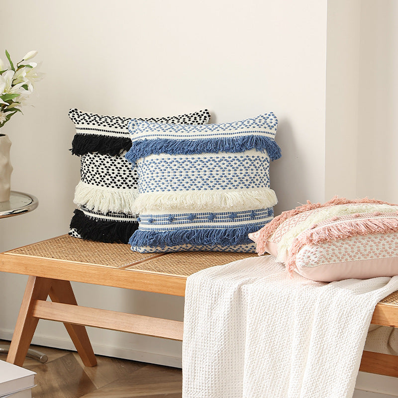 Textured Boho decorative pillow with fringes, tassels, and woven dot pattern