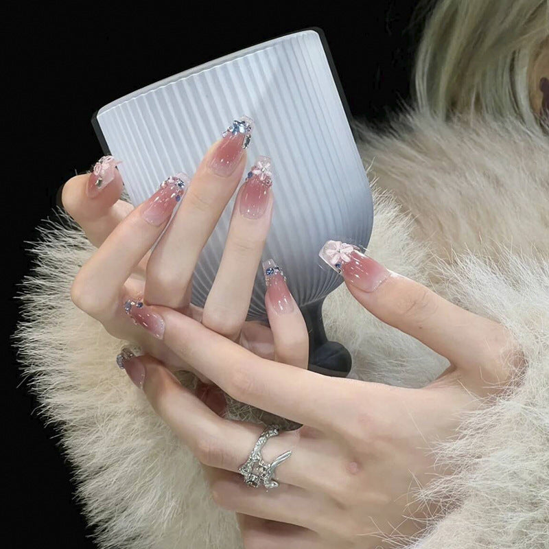 Artificial nail set with glamorous 3D decorations and shimmering accents Stornfield