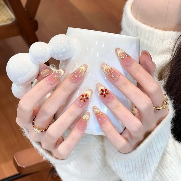 Artificial nails with elegant flower design and glitter accents Stornfield