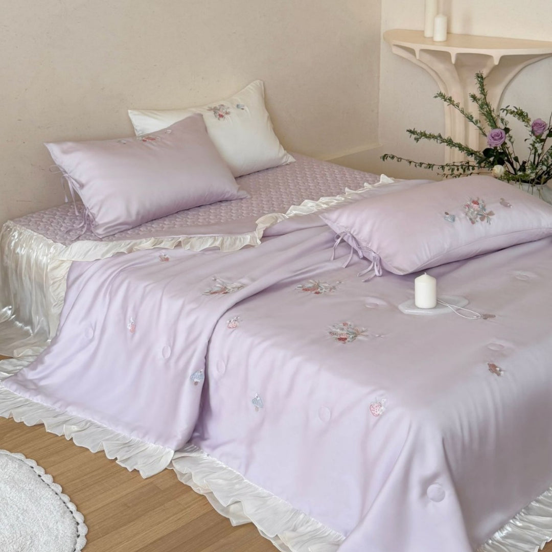 Romantic satin bedding set with ruffle, floral embroidery and tie pillow