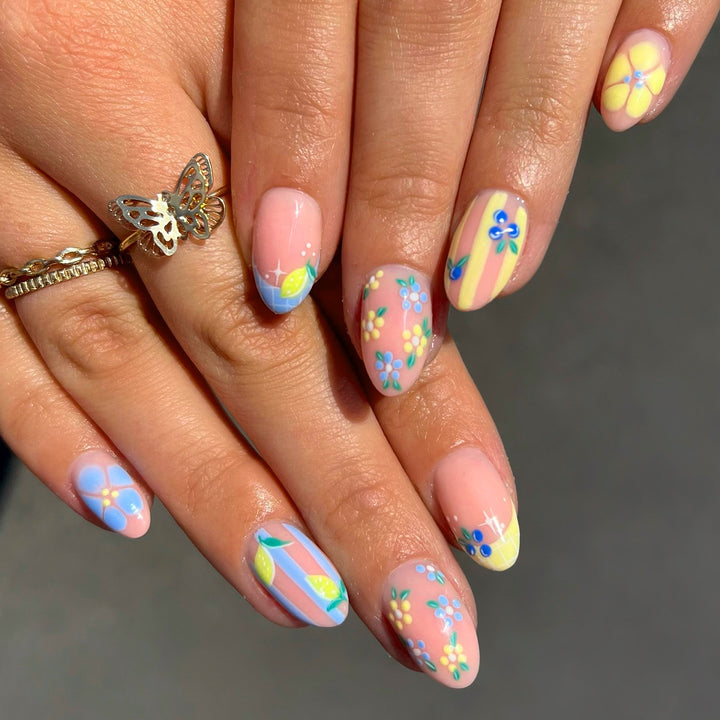 Artistic 3D nail art with cheerful floral designs Stornfield
