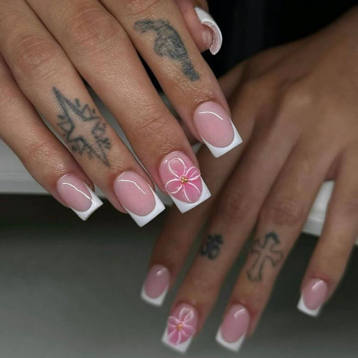 Artistic nail art with delicate flowers and elegant French lace Stornfield