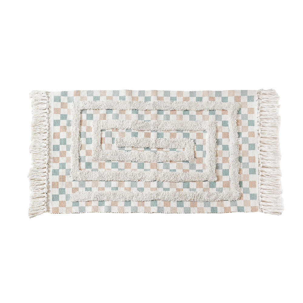 Handwoven cotton runner with pompom tufting and decorative fringes