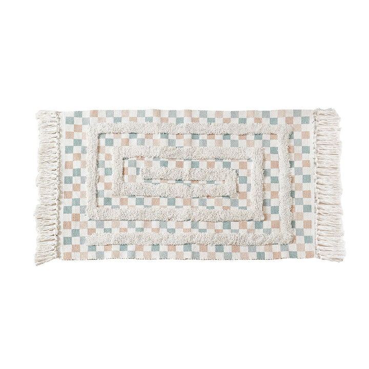 Handwoven cotton runner with pompom tufting and decorative fringes