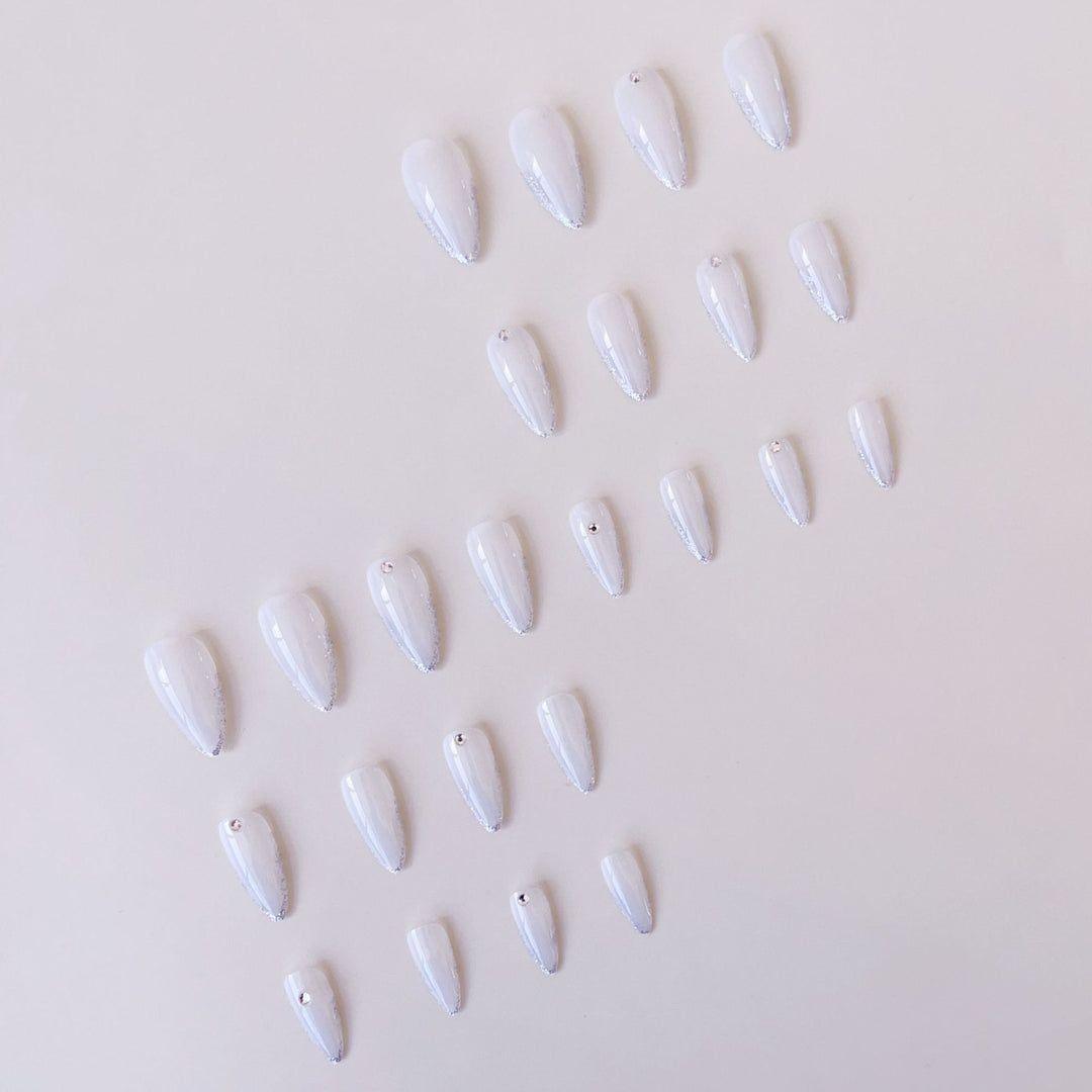 Acrylic nail set with elegant tips and sparkling accents Stornfield