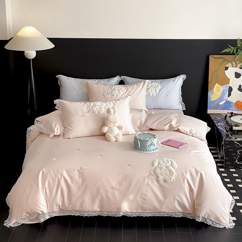 Luxurious satin bedding set with plush bunny appliqué and lace trim