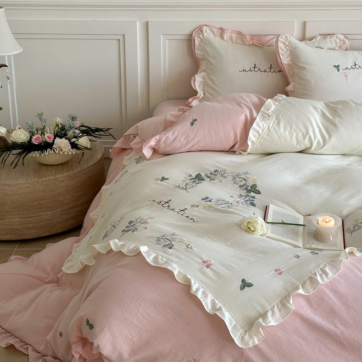 Bedding set with ruffles, embroidered middle cover and delicate flower application