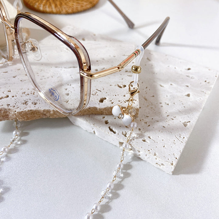 Elegant earrings with pearls and flower pendants Stornfield
