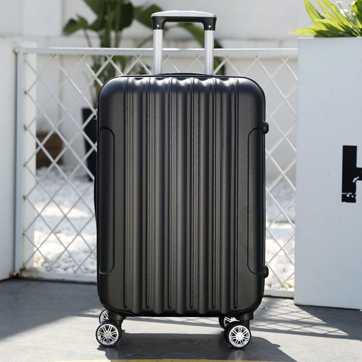 Hard shell suitcase with 360-degree wheel system and integrated safety feature Stornfield