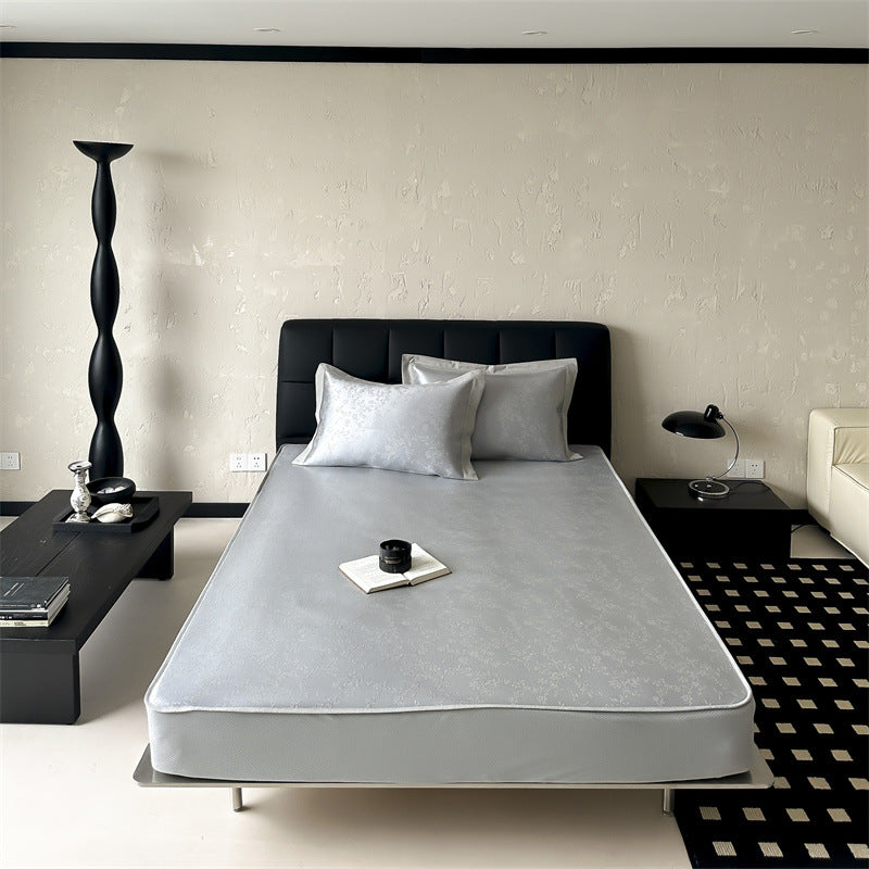 high-quality non-slip mattress protector with integrated fitted sheet and elegant jacquard pattern