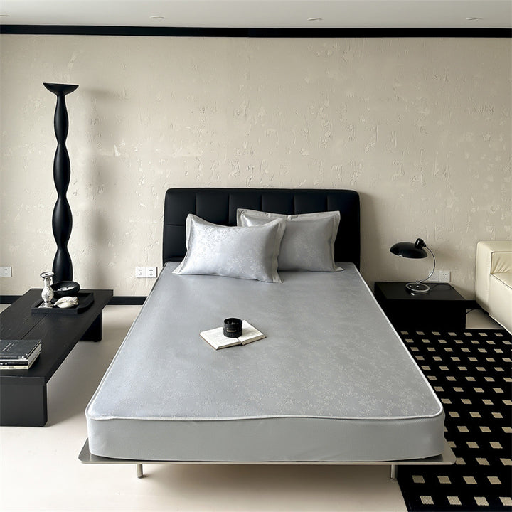 high-quality non-slip mattress protector with integrated fitted sheet and elegant jacquard pattern