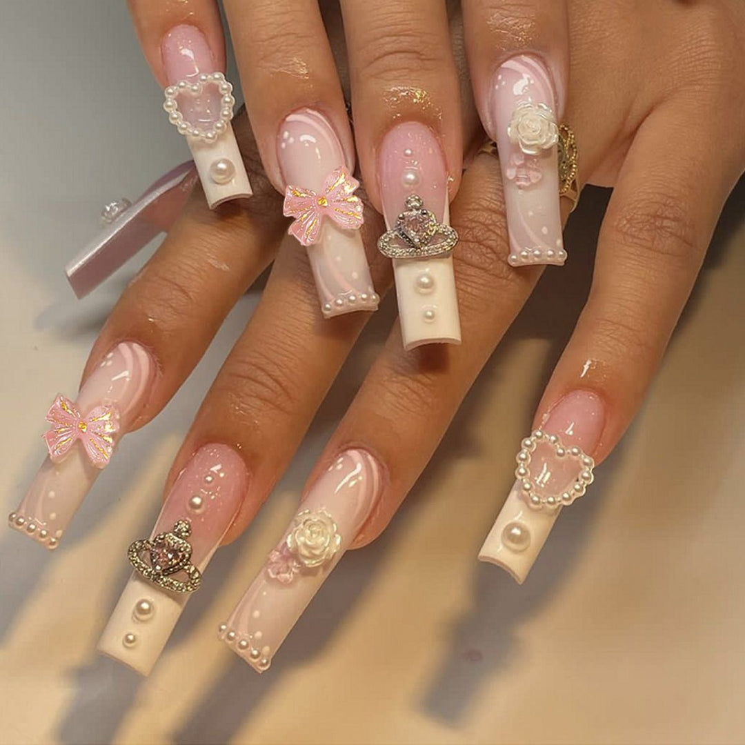 Artful nail tips with pearl and bow motifs Stornfield