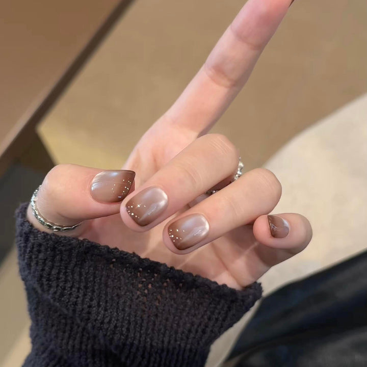 Artificial nails with elegant gradient color and glitter elements Stornfield