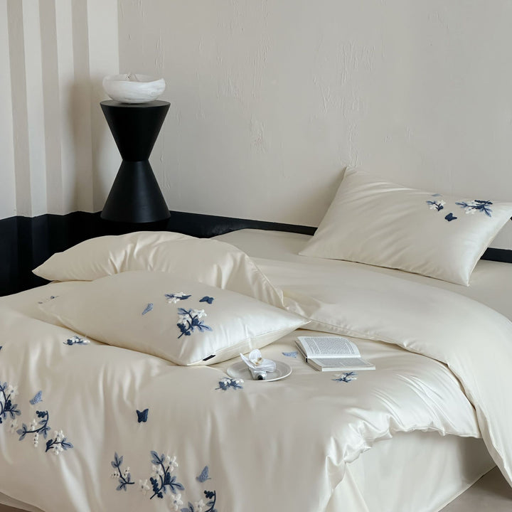 Luxurious satin bedding set with blue flower embroidery