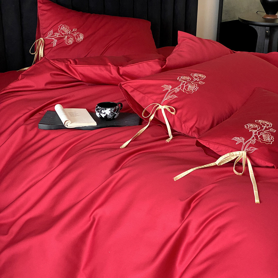 Premium cotton satin bedding set with botanical embroidery and decorative cushion ties